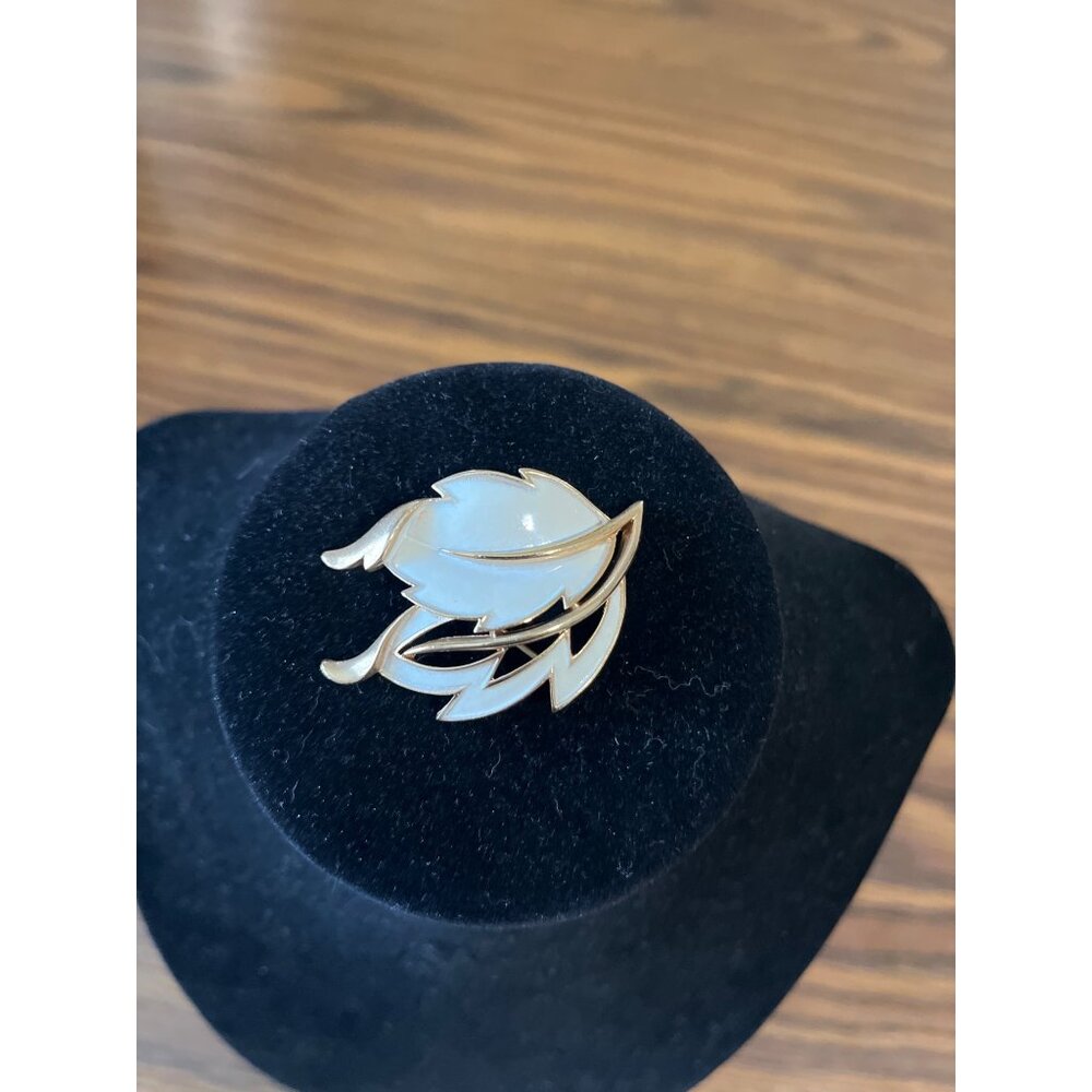 Crown Trifari gold tone and white enamel leaf design brooch